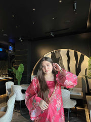 Rosé Bloom Set featuring a floral paper silk kaftan with bead embellishments, styled in a modern lounge setting. Elegant festive nightwear.