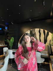 Rosé Bloom Set featuring a floral paper silk kaftan with bead embellishments, styled in a modern lounge setting. Elegant festive nightwear.